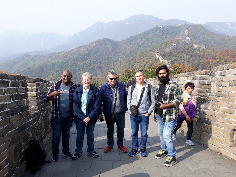 With the entire team on great wall of China